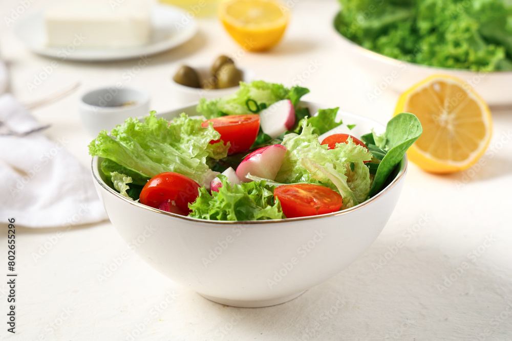 Bowl of healthy salad on light table