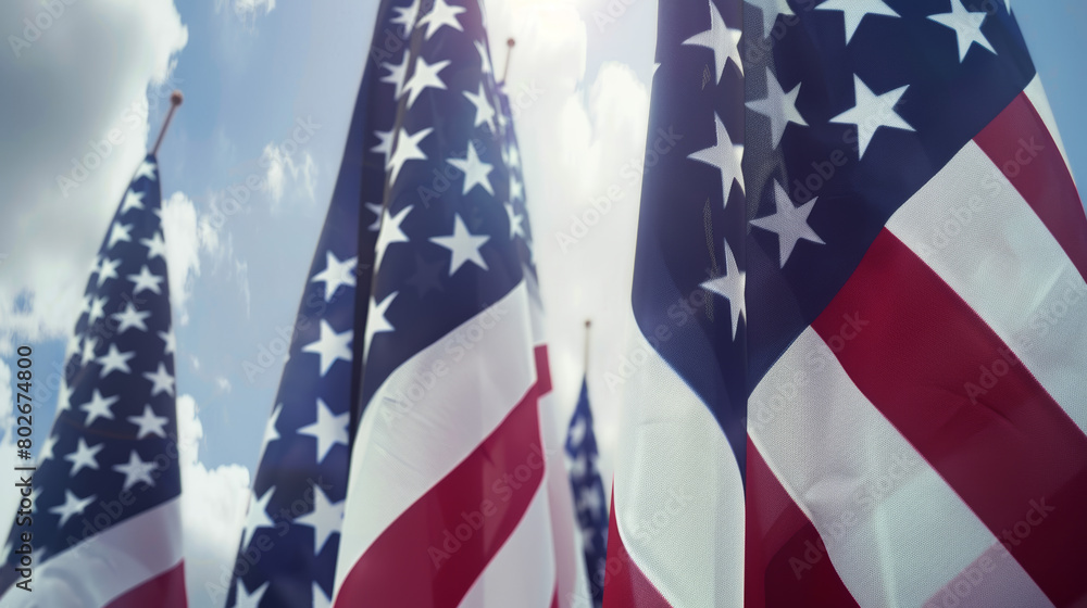 Fototapeta premium American flags waving under blue sky patriotic backdrop