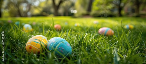 Easter eggs resting on verdant grass symbolize the arrival of spring festivities.