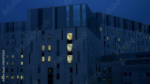 Static view of a modern builiding in changes of light in late night. Time lapse photo