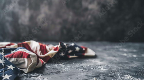 American flag crumpled on textured dark background