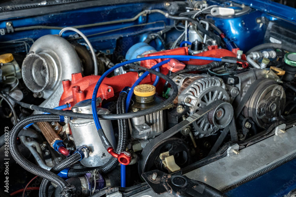 A close-up view of a motor engine, showcasing intricate metal parts and chrome details