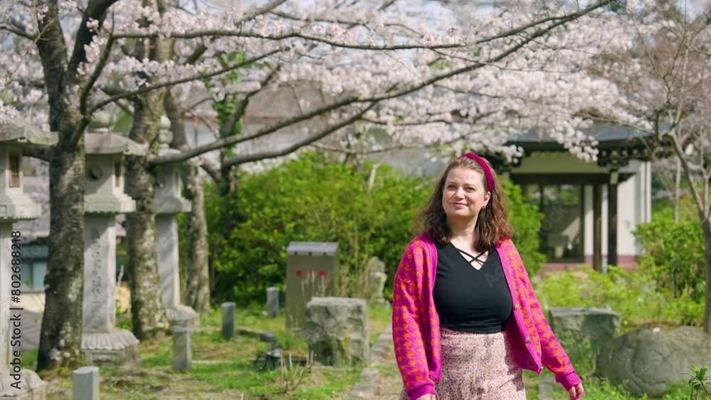 Female Tourist Enjoying Sakura Scenery At Tsubosaka-dera Temple In Takatori, Japan. medium shot Female Tourist Enjoying Sakura Scenery At Tsubosaka-dera Temple In Takatori, Japan. medium shot