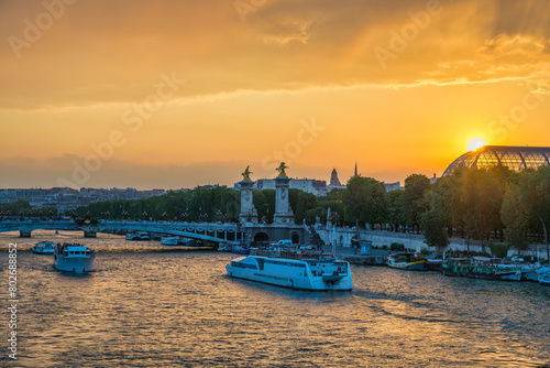Paris France, city skyline sunset at Seine River with Pont Alexandre III bridge and Grand Palais