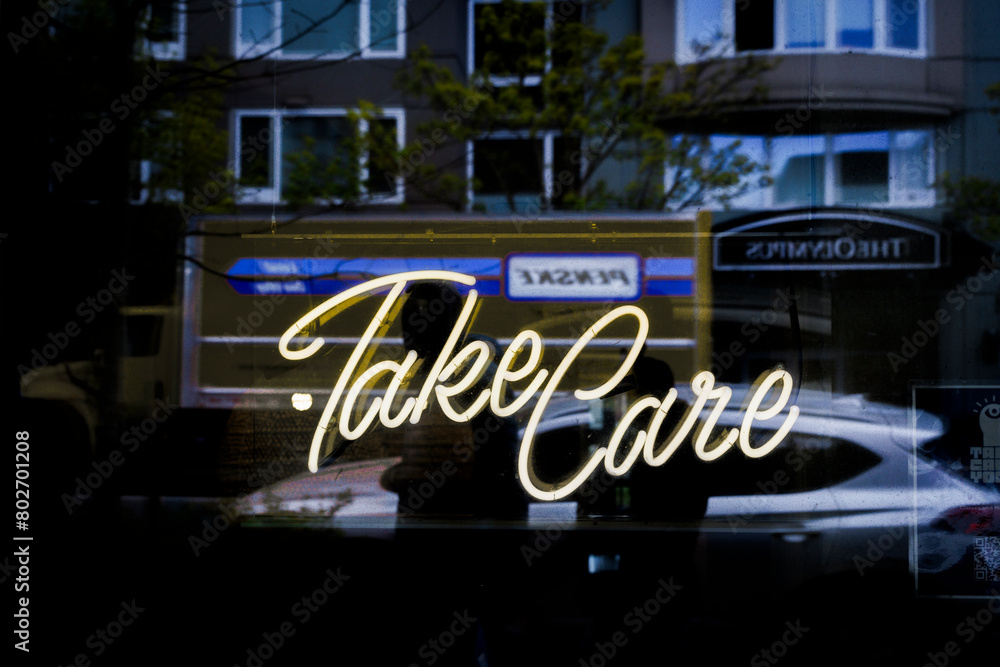 Take Care, reflection in glass