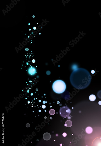 Abstract blue bokeh lights on a black background.