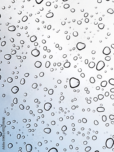 Water drops on glass as a background. Shallow depth of field.