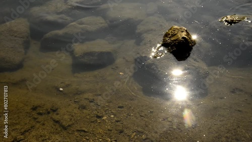 rocket in the river Danuvia with sun reflexions, zoom in photo