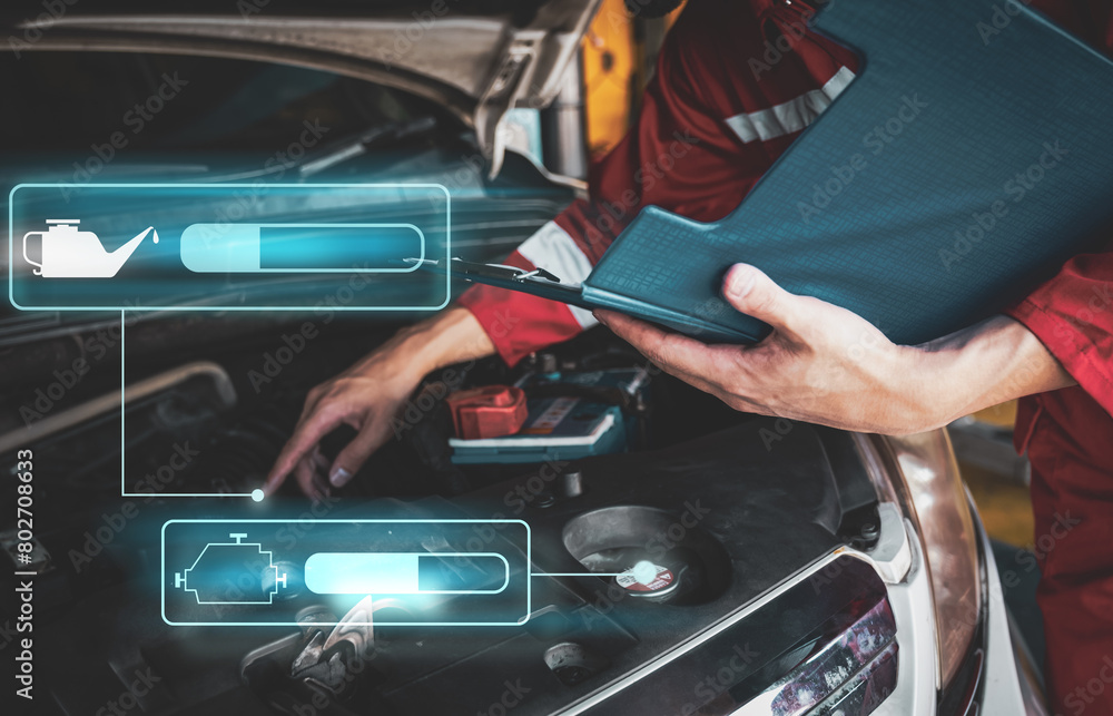 Car mechanic inspects car using technology and computer show resault at virtual screen. Car mechanic inspects car using technology and computer show resault at virtual screen.