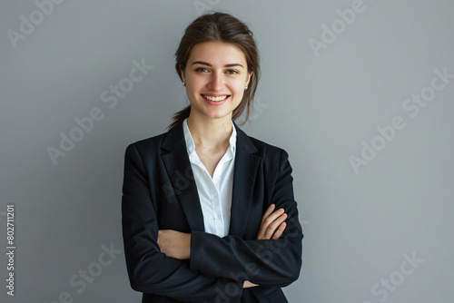 Beautiful smiling business woman with arms crossed isolated on white background