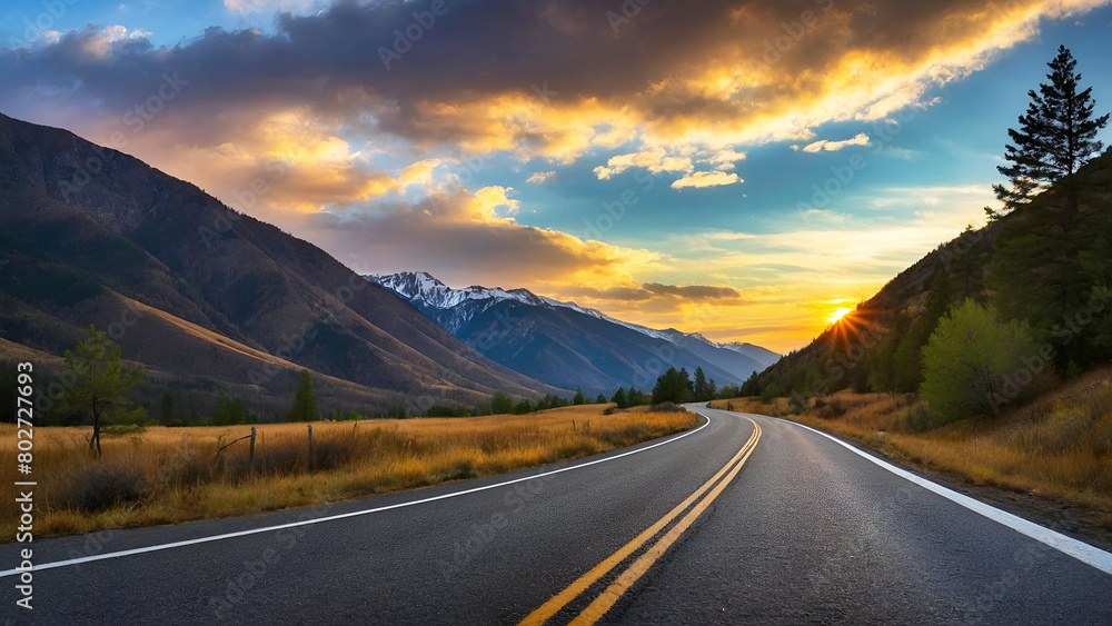 A road with a yellow line down the middle and mountains in the background. The sun is setting and the sky is orange