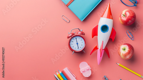 Paper rocket with school stationery alarm clock photo