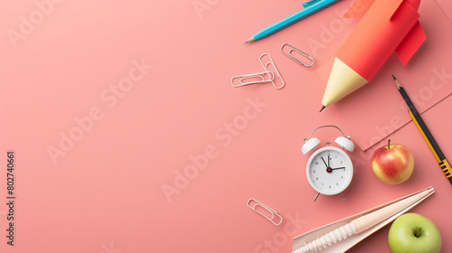 Paper rocket with school stationery alarm clock photo
