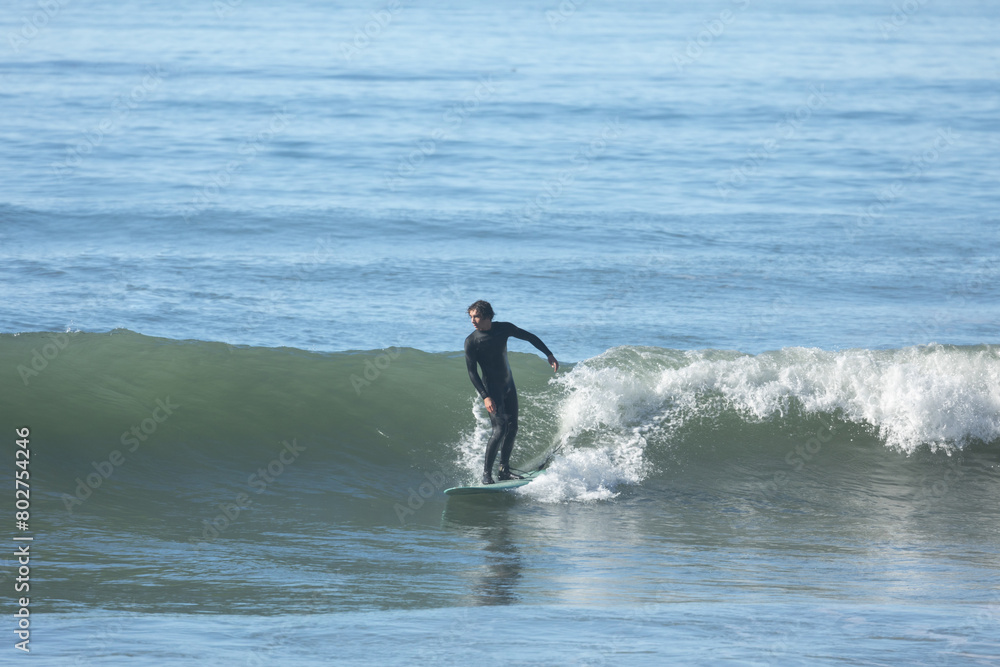 Surfer catches a wave at Solimar Beach, in Ventura, California. Surfer catches a wave at Solimar Beach, in Ventura, California.