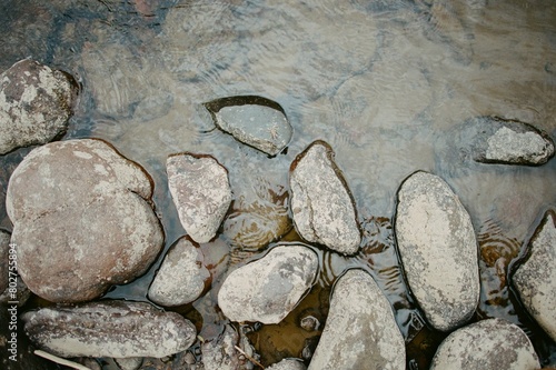 Rocks on a muddy riverbed photo