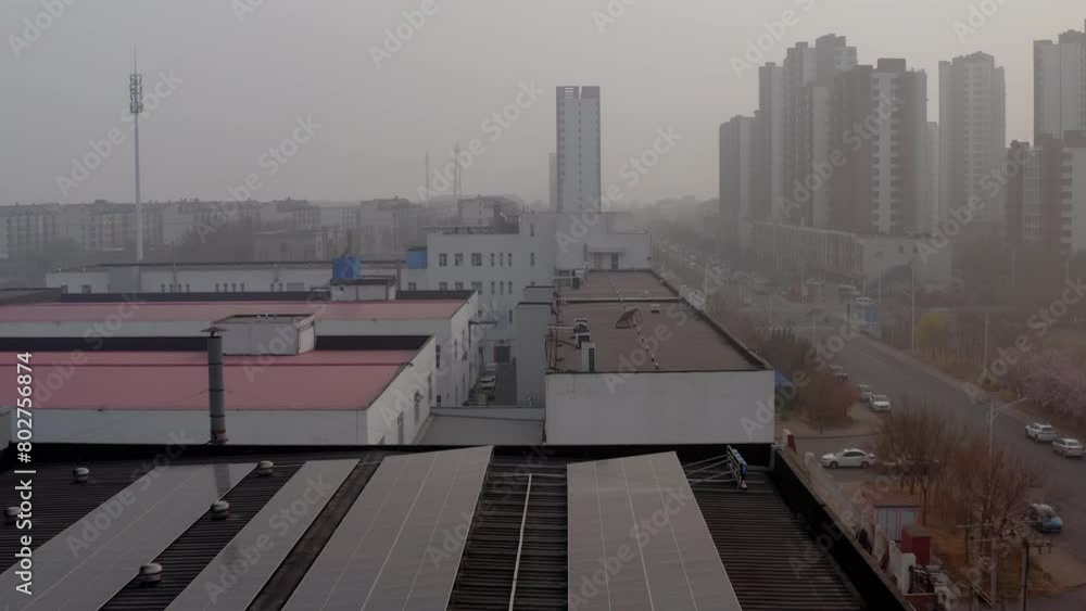 Solar panels installed on the roof provide the factory with clean energy. Industrial zone in Tianjin, China. Residential communities near factories provide housing for workers. Smog and air pollution Solar panels installed on the roof provide the factory with clean energy. Industrial zone in Tianjin, China. Residential communities near factories provide housing for workers. Smog and air pollution
