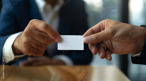 Businessman giving a blank business card to his colleague in the office. AI.
