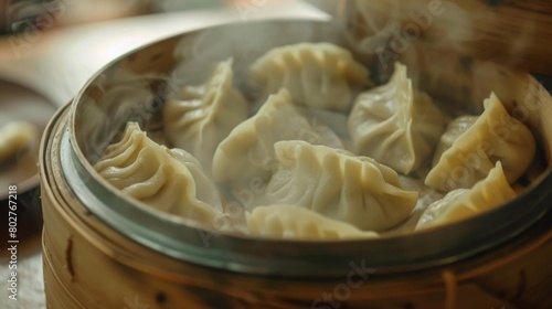 A close-up of a steaming bamboo steamer releasing aromatic clouds as it opens, revealing a batch of freshly cooked momos.