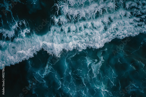 Abstract aerial view of dark blue ocean waves, top down view