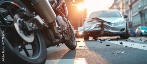 Close up of a motorbike accident with a car on the street