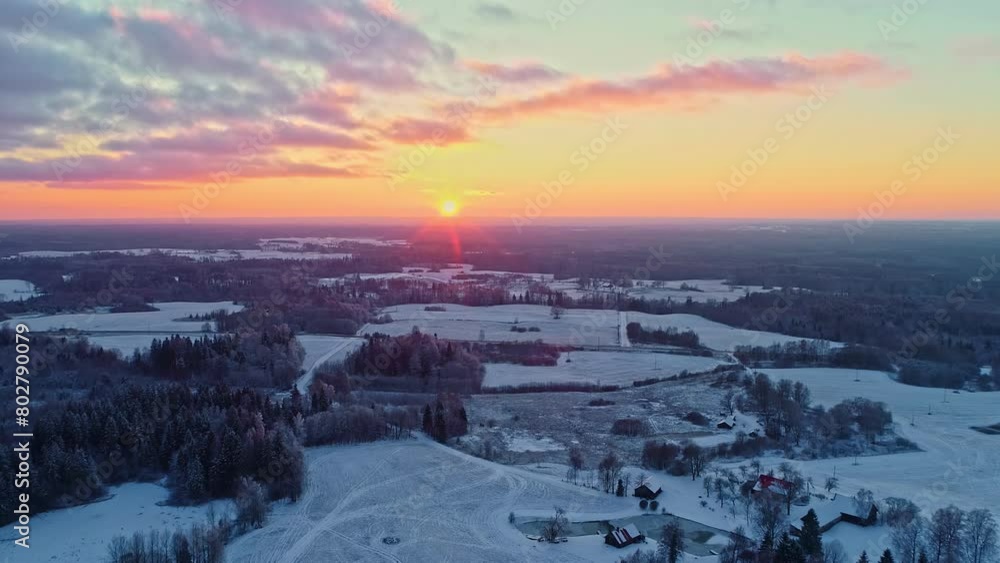 Sunset over snowy landscape, vibrant skies, winter dusk, aerial view Sunset over snowy landscape, vibrant skies, winter dusk, aerial view