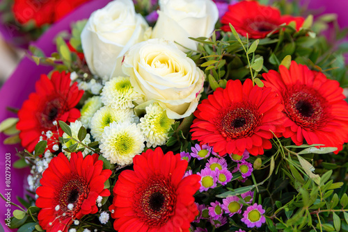 bouquet of red gerberas and white roses in spring © funkenzauber