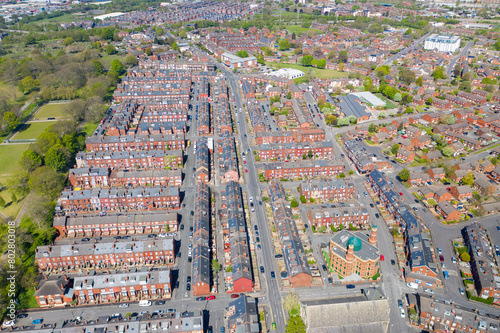 Aerial photo of the village of Beeston in Leeds West Yorkshire, showing typical British 1940's rows or terrace houses and streets along side the Cross Flatts public park area photo