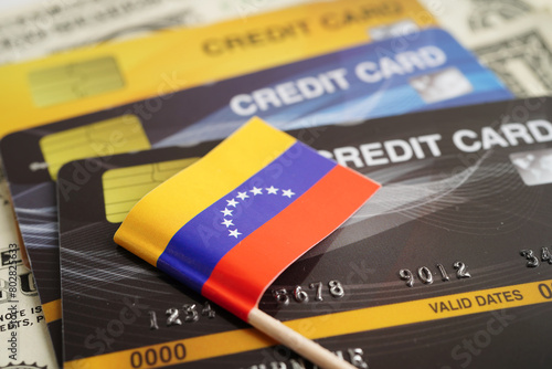 Venezuela flag on credit card, finance economy trading shopping online business. photo
