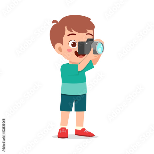 little kid holding camera and take photo