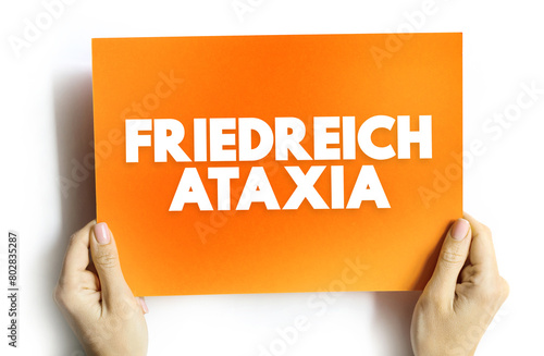 Friedreich's Ataxia is a rare, inherited, degenerative disease that damages the spinal cord, peripheral nerves and the cerebellum, text concept on card photo