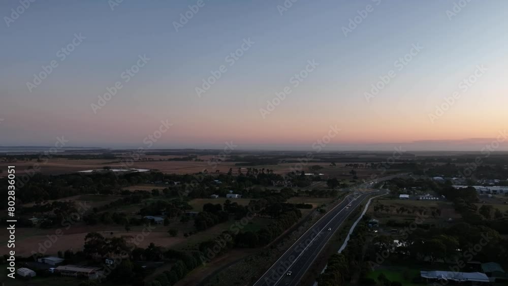 Sunset over highway with cars on it Sunset over highway with cars on it