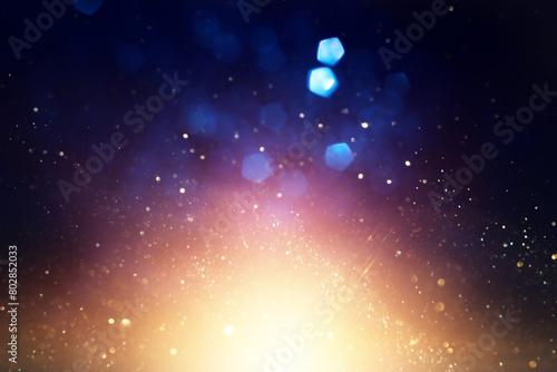 abstract glitter black, blue and gold lights background. de-focused © tomertu