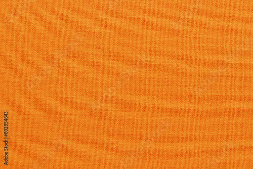 Orange cotton fabric cloth texture for background, natural textile pattern.