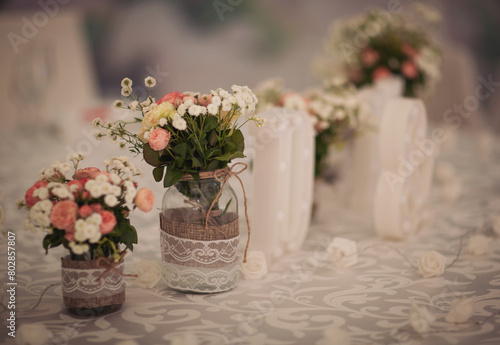 Table decoration on a wedding with flower napkins and candles. Flower table decoration at a wedding. 