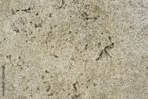 Beige stone surface photographed from above