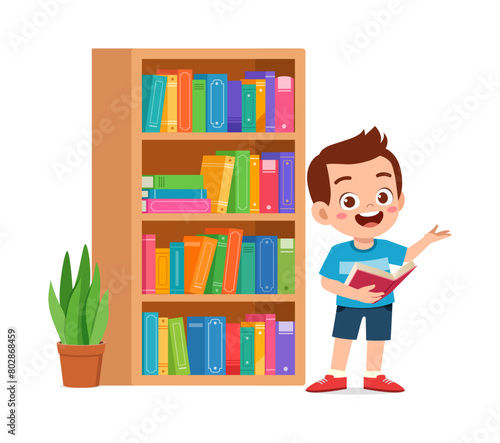 little kid read book in the library