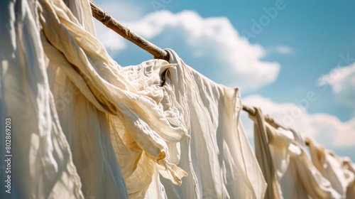 Colorful clothes and linens elegantly swaying in the breeze on a clothesline, creating a mesmerizing visual display photo