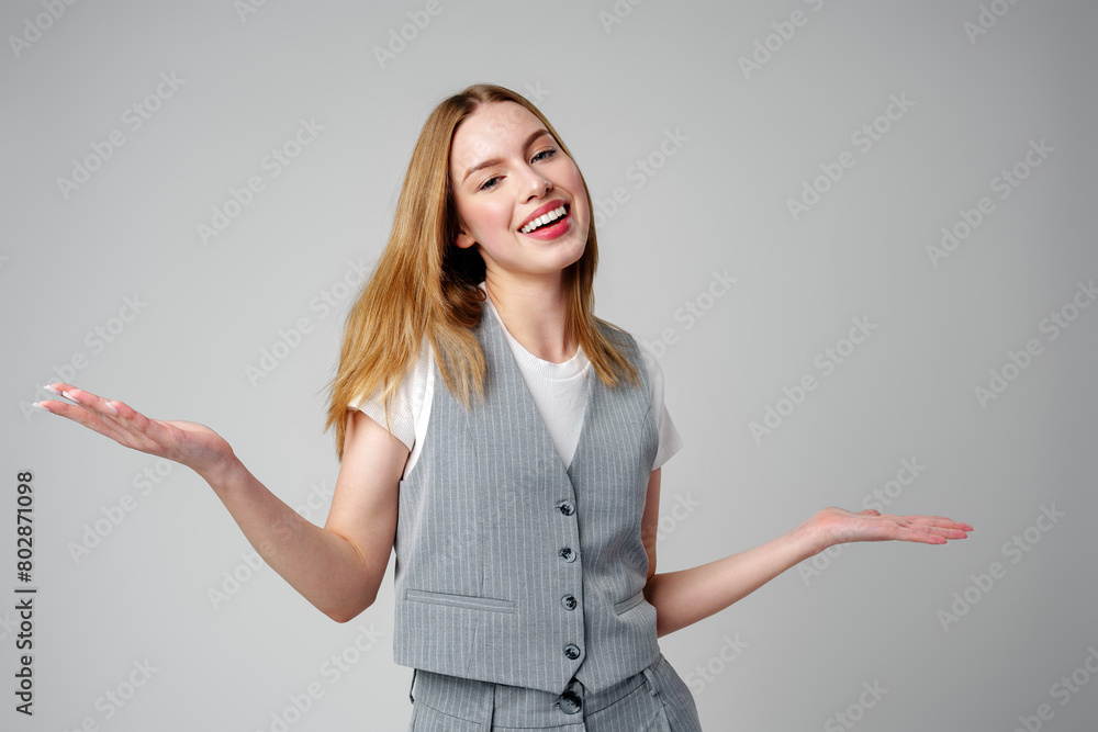 Joyful Young Blonde Woman Smiling against gray background Joyful Young Blonde Woman Smiling against gray background