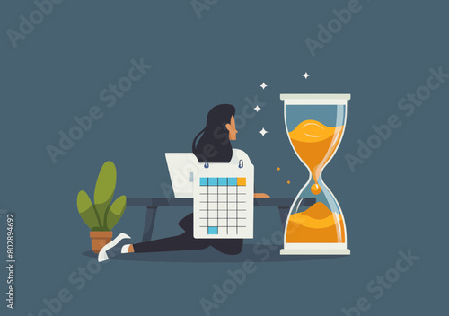 Office Worker on Laptop with Hourglass Timer and Calendar, Deadline Project Management Concept for Productivity and Time Crunch photo