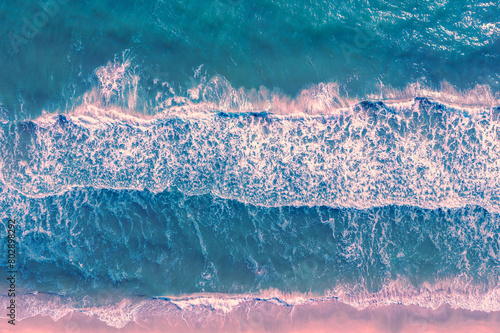 Ocean surf. Waves roll onto the shore. View from above. Nature abstract background. Horizontal banner © vvvita