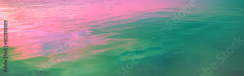 Sea water surface at sunset. View from above. Artistic pink blue gradient color. Horizontal banner © vvvita