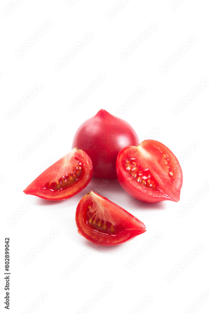 Cut and whole of pink tomato isolated on white background.