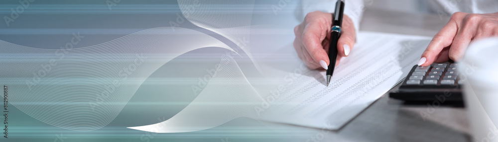 Female hands using calculator; panoramic banner Female hands using calculator; panoramic banner