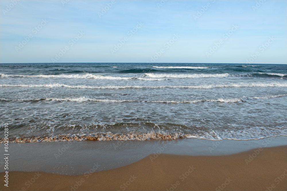 Cyprus sandy beaches. Cyprus Alagadi Turtle Beach. View from the beach to the sea. Magnificent beach, sea and blue cloudy sky. Cyprus sandy beaches. Cyprus Alagadi Turtle Beach. View from the beach to the sea. Magnificent beach, sea and blue cloudy sky.