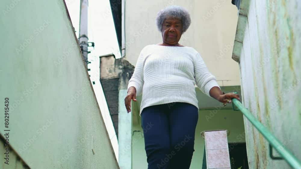 South American Senior Black Woman in Her 80s Descending Stairs to Sidewalk for Daily Outing, Independent Elderly Lady Embracing Routine South American Senior Black Woman in Her 80s Descending Stairs to Sidewalk for Daily Outing, Independent Elderly Lady Embracing Routine