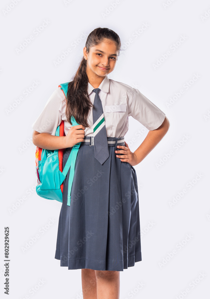 Portrait of cheerful Indian asian teenage schoolgirl with school uniform and backpack Portrait of cheerful Indian asian teenage schoolgirl with school uniform and backpack