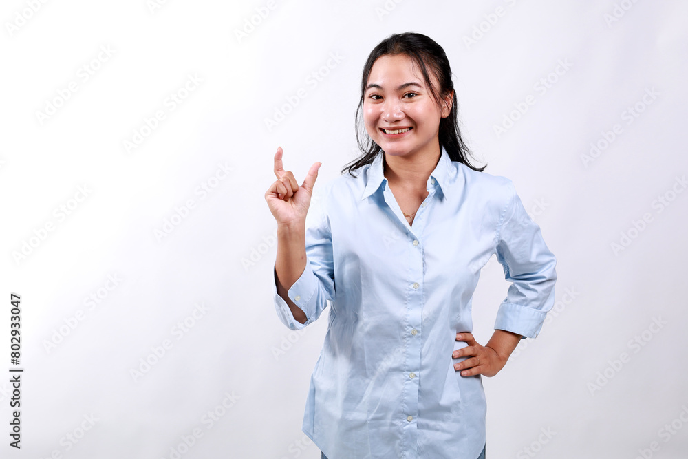 Asian business woman standing holding something on her hand with happy face expression Asian business woman standing holding something on her hand with happy face expression