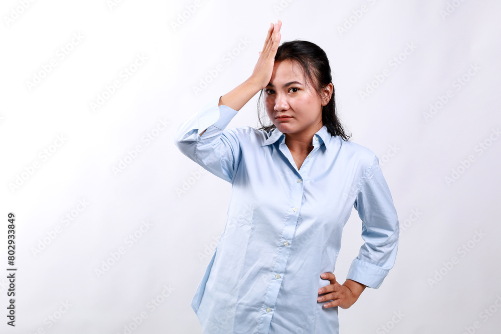 Portrait of asian woman touches her head, looks upset or disappointed, forgot something, has headache, migraine. Isolated on white background. Portrait of asian woman touches her head, looks upset or disappointed, forgot something, has headache, migraine. Isolated on white background.