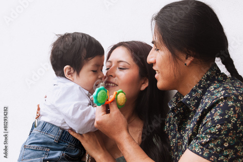 Loving family moment with parents and baby.