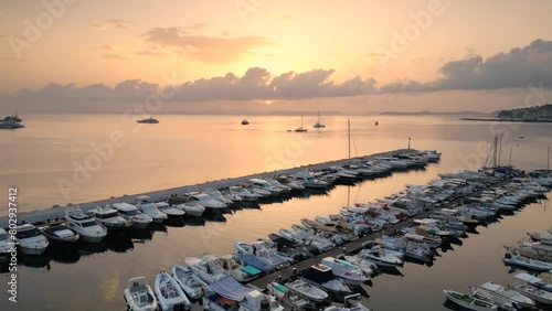 Vista aerea dell'alba del porto di Lacco Ameno ad Ischia. Roccia, mare, sole e mille colori photo